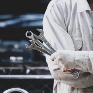 car-repairman-wearing-white-uniform-standing-holding-wrench-that-is-essential-tool-mechanic